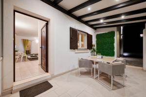 a dining room with a table and chairs at Villa Demonta in Trogir