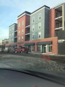 a view from a car of a street with buildings at Mike's Studio off Whyte! in Edmonton