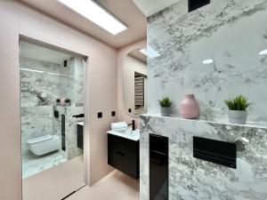 Kúpeľňa v ubytovaní Apartamenty Maxa Czornyja