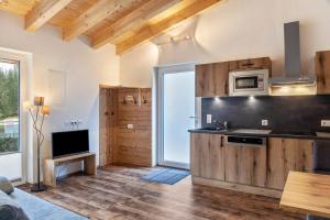 a kitchen with a sink and a microwave at Ferienwohnung Daniel in Ehrwald