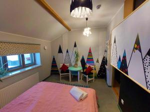 Postel nebo postele na pokoji v ubytování Looming Hostel