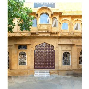 a building with a gate in front of it at WelcomHeritage Kalyan Bhawan Hotel in Jaisalmer
