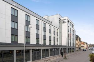 a large white building on a city street at Best Western Plus Hus 57 in Ängelholm