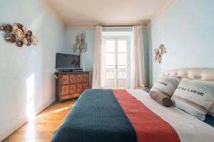 a bedroom with a bed and a television in it at Santa Giuliana Apartment in Como