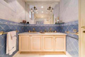 a bathroom with a sink and a mirror at Santa Giuliana Apartment in Como +26 photos