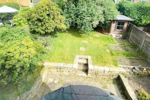 an aerial view of a yard with grass and trees at 3 BR Property in Prestwich 15 mins from Manchester City Centre Garden Free parking Superfast WIFI Netflix in Manchester