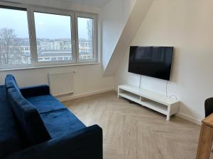Telewizja i/lub zestaw kina domowego w obiekcie Apartament Metropolis 15