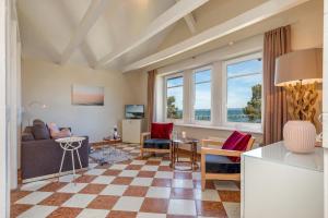 a living room with a couch and a table at Villa Quisisana in Binz