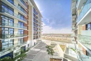 an aerial view of an apartment building with balconies at Urban 1BR at DAMAC Celestia B Dubai South by Deluxe Holiday Homes in Dubai