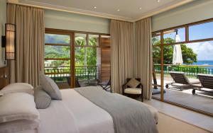Voodi või voodid majutusasutuse Savoy Seychelles Resort & Spa toas