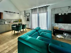 Posedenie v ubytovaní Apartamenty Maxa Czornyja