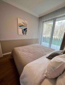 Postel nebo postele na pokoji v ubytování Luksusowy Apartament Niechorze 122