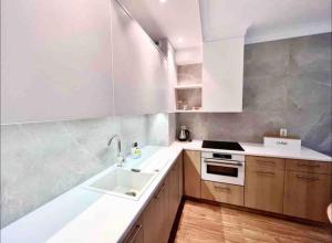 Kuchyň nebo kuchyňský kout v ubytování Luksusowy Apartament Niechorze 122 + 18 fotografií