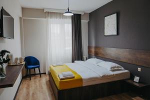 Voodi või voodid majutusasutuse GABATA INN toas