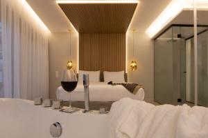 Postel nebo postele na pokoji v ubytování Incanto Boutique Suites - Mets