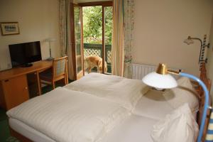 Letto o letti in una camera di Hotel Voglauerhof