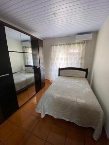 En eller flere senge i et værelse på Casa Veraneio em Zimbros - Bombinhas