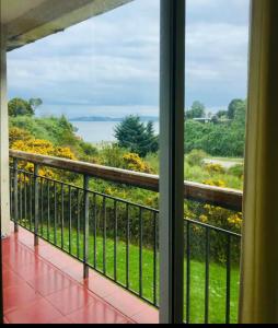 a balcony with a view of the ocean at Pelluco in Puerto Montt