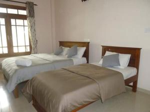 Katil atau katil-katil dalam bilik di Castlereagh Resort Hatton