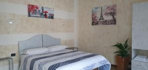 A bed or beds in a room at Le Rustiche Foresteria