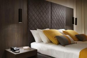 Cama ou camas em um quarto em B&B Baciami Ancora