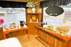 a kitchen with a counter with some food on it at Love Hotels Tomahawk at Lake Mohawksin WI in Tomahawk
