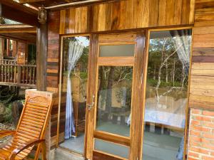 an open door to a screened in porch at Floor river view in Cat Tien