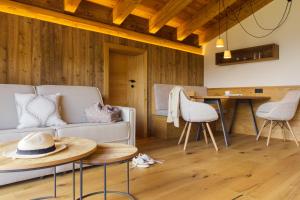 a living room with a couch and a table at Triendlhof in Zöblen