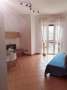 a bedroom with a bed and a desk and a window at IEO -Humanitas - SUNNY HOUSE - Comodissimo in Locate di Triulzi