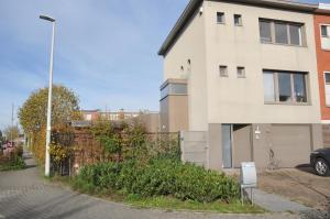 a building with a sign in front of it at at Number 1 in Rumst