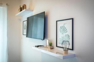 A television and/or entertainment centre at Venus Apartments - Westside residence