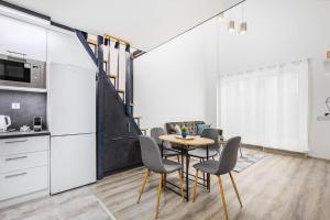 A kitchen or kitchenette at Venus Apartments - Westside residence