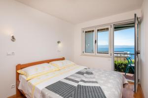 Posteľ alebo postele v izbe v ubytovaní Sunny Vista Apartment