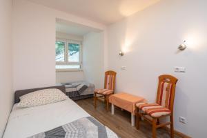 Posteľ alebo postele v izbe v ubytovaní Sunny Vista Apartment
