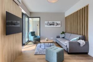 a living room with a couch and a table at Villa Bella and Chiara by SeeAdria Agency in Brtonigla