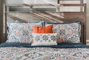 a pile of pillows on a bed in a bedroom at Lovely 2BR apartment by Wooster Square- great neighborhood in New Haven