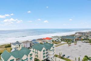 an aerial view of a beach with houses and the ocean at Paradise Villa in Ocean Isle Beach