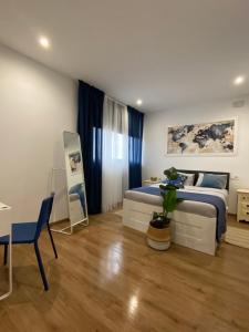 Postel nebo postele na pokoji v ubytování Hostal Orange Vibes