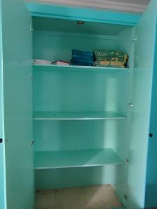 a blue closet with shelves in a room at Farsha View in Sharm El Sheikh