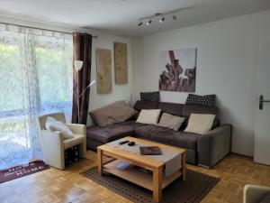 a living room with a couch and a coffee table at Ferienpark im schönen Falkenstein 7 in Falkenstein