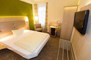 Postel nebo postele na pokoji v ubytování Hermes Hotel Oldenburg