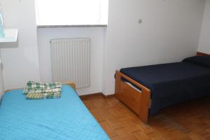 Postel nebo postele na pokoji v ubytování Appartamento Widmann