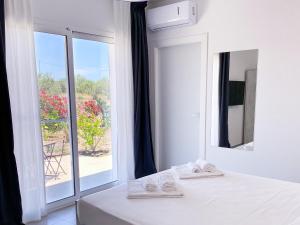 Posteľ alebo postele v izbe v ubytovaní Dimora Calauriia - Adults Only + 37 fotografií