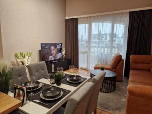 Posezení v ubytování АПАРТАМЕНТ RESORT SENSATION 2