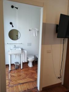 a bathroom with a sink and a toilet at Palazzo Pasta Malpensa in Gallarate