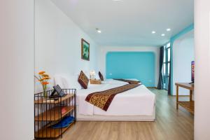 Postel nebo postele na pokoji v ubytování Prime New Hotel
