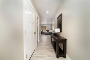 a hallway with a room with a living room at Delightful, new townhome downtown in Billings