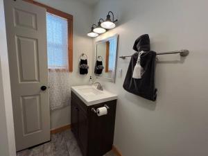 a bathroom with a sink and a mirror at Timelessly restored home - entirely yours to enjoy in Billings
