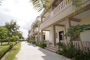 a building with a walkway in front of it at Amar Bagh Resort in Pushkar