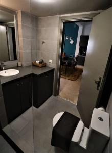 a bathroom with a toilet and a sink at Central studio in Monastiraki B in Athens